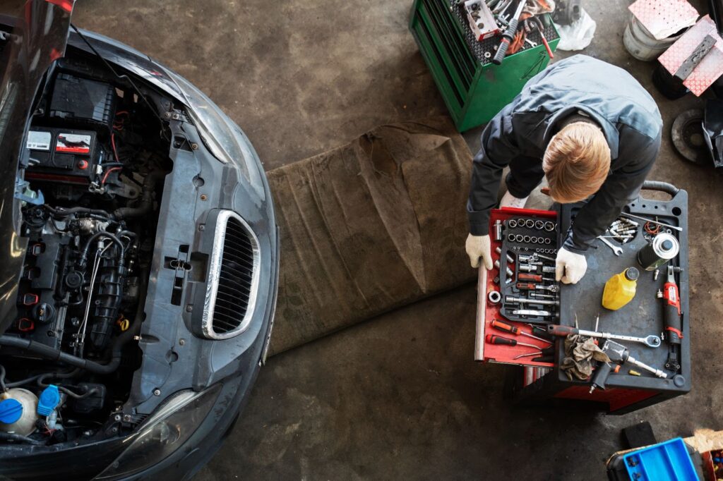 Top view of man repairing car