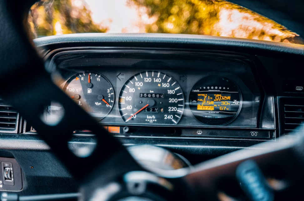 speedometer and fuel consumption meter of a car behind the direction control wheel
