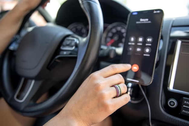 A person is talking on the phone in the car